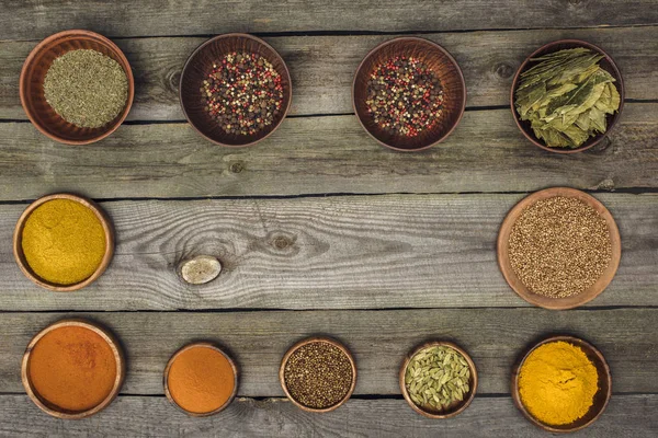 Wooden bowls with different spices — Stock Photo