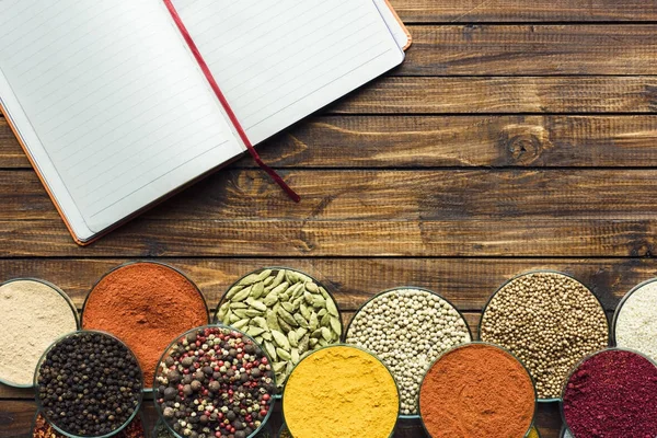 Notebook for recipes and spices — Stock Photo