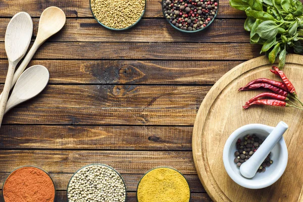 Pestle and mortar on wooden board — Stock Photo