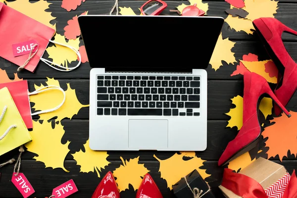 Laptop on paper foliage — Stock Photo