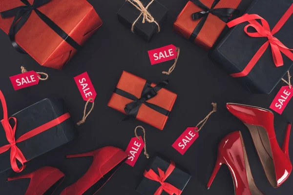 Heels, presents and sale tags — Stock Photo