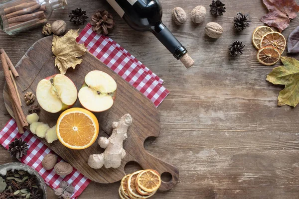 Fruits and ginger on wooden board — Stock Photo