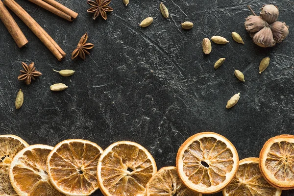 Dried oranges with seeds and carnation — Stock Photo