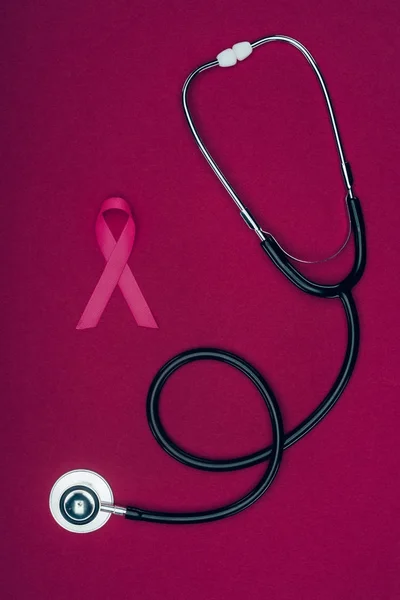 Stethoscope and pink breast cancer ribbon — Stock Photo