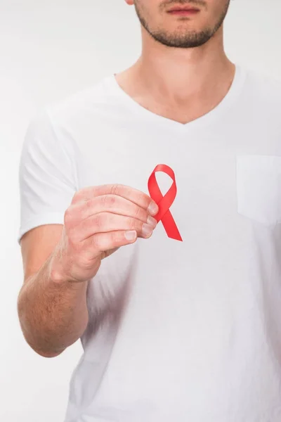 Man with red aids ribbon — Stock Photo