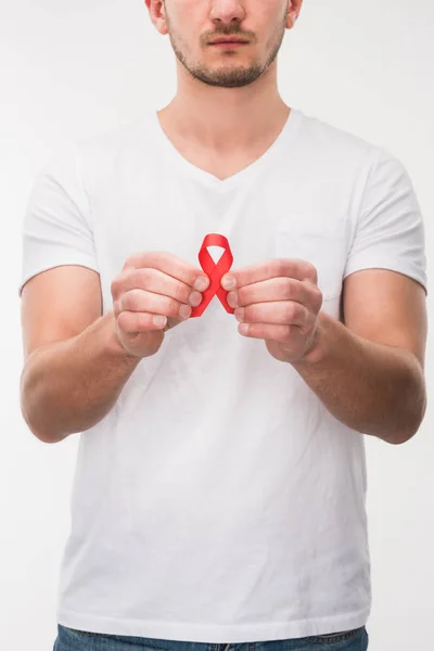 Man with red aids ribbon — Stock Photo