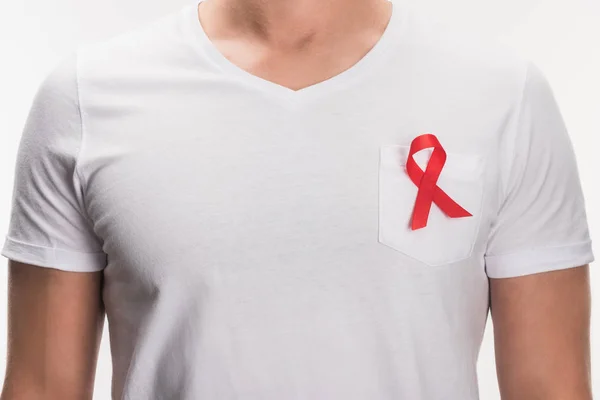 Aids ribbon on white t-shirt — Stock Photo