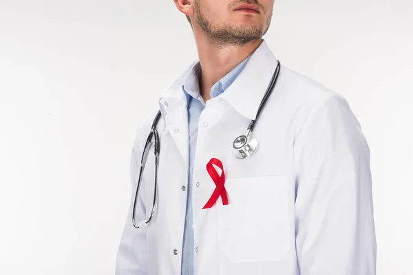 Doctor with stethoscope and aids ribbon — Stock Photo