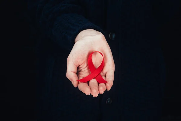 Woman with red aids ribbon — Stock Photo