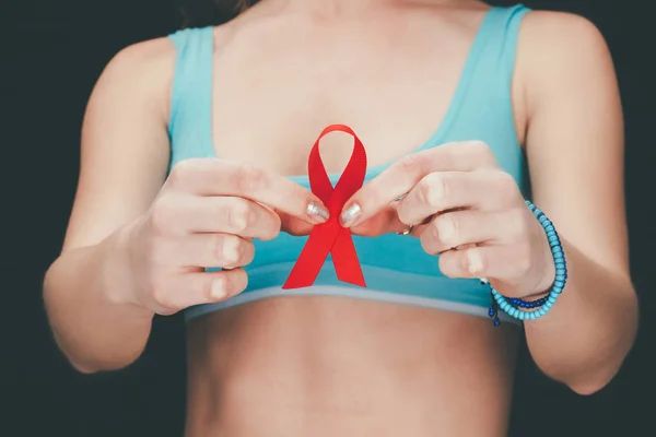 Woman holding aids ribbon — Stock Photo