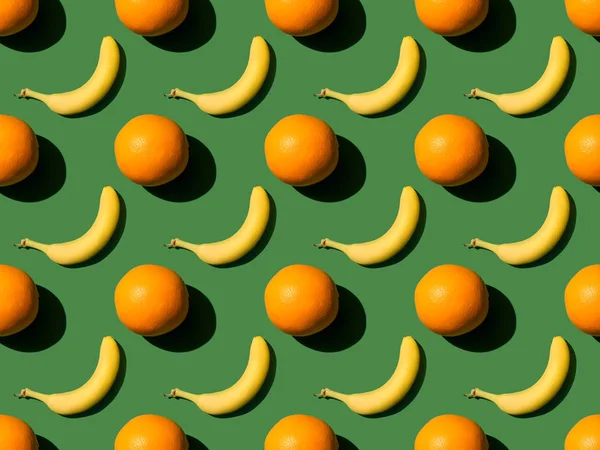 Padrão de laranjas e bananas — Fotografia de Stock