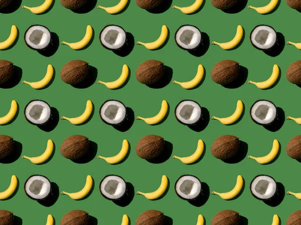 Pattern with bananas and coconuts — Stock Photo