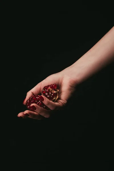 Pomegranate in hand — Stock Photo