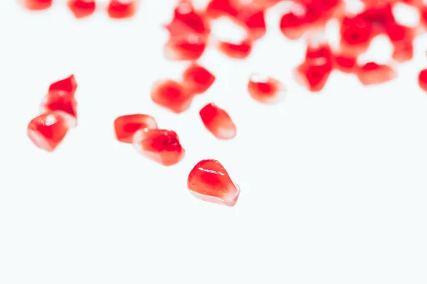 Scattered pomegranate seeds — Stock Photo