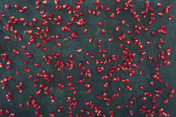 Scattered pomegranate seeds — Stock Photo