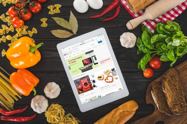 Digital tablet and fresh ingredients — Stock Photo