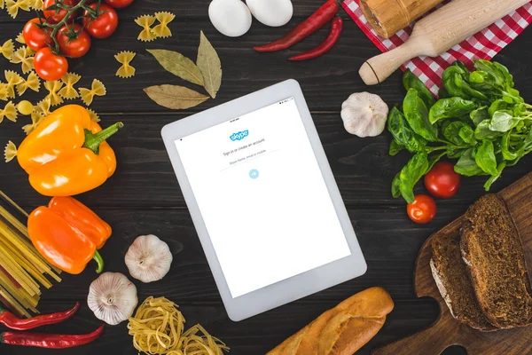 Digital tablet and fresh ingredients — Stock Photo