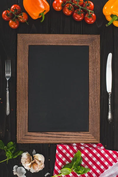 Blank frame and cutlery — Stock Photo