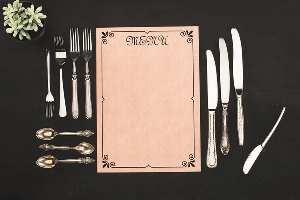 Menu and cutlery — Stock Photo