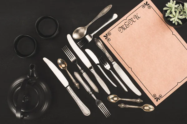 Menu, cutlery and tea set — Stock Photo