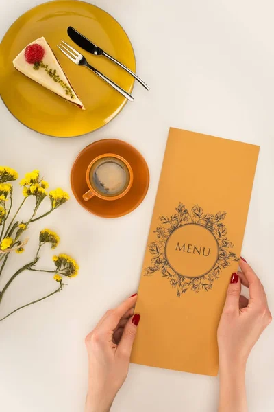 Menu in hands — Stock Photo