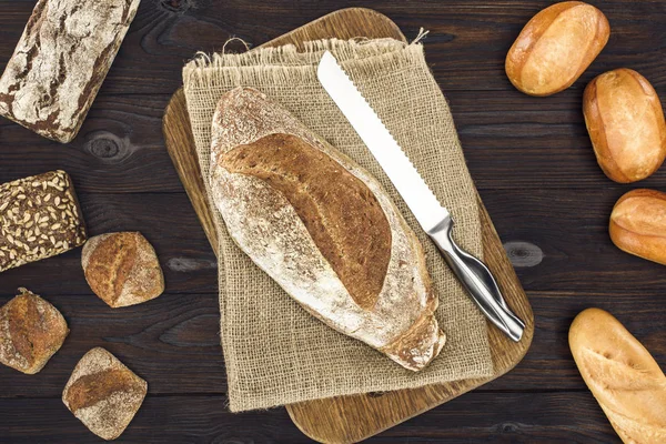 Homemade bread and knife — Stock Photo