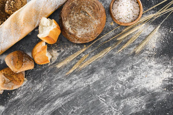 Homemade bread and spikelets — Stock Photo