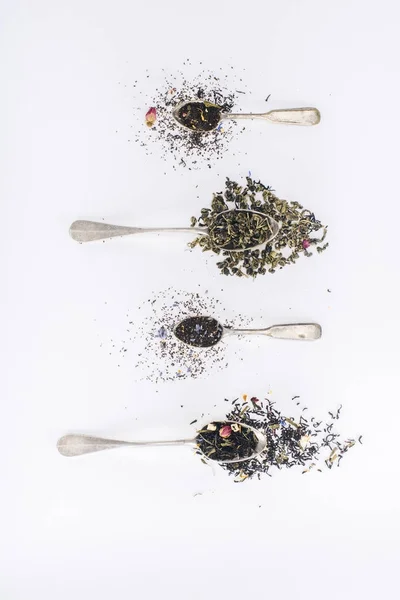 Herbal tea and spoons — Stock Photo