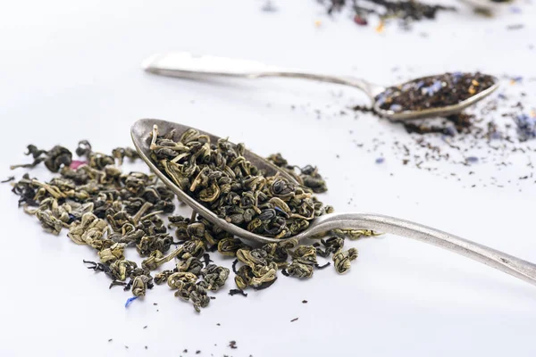 Herbal tea and spoons — Stock Photo