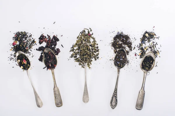 Herbal tea and spoons — Stock Photo