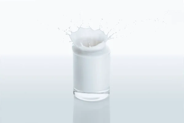 Splash of milk in glass — Stock Photo