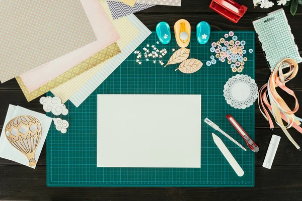 Top view of empty sheet of paper on designer table — Stock Photo