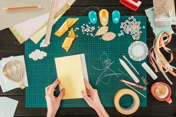 Cropped image of designer making template for scrapbooking postcard — Stock Photo