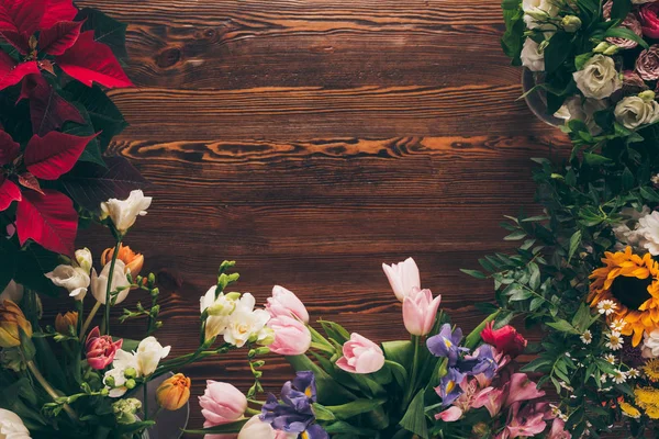 Top view of colored flowers on table in flower shop — Stock Photo