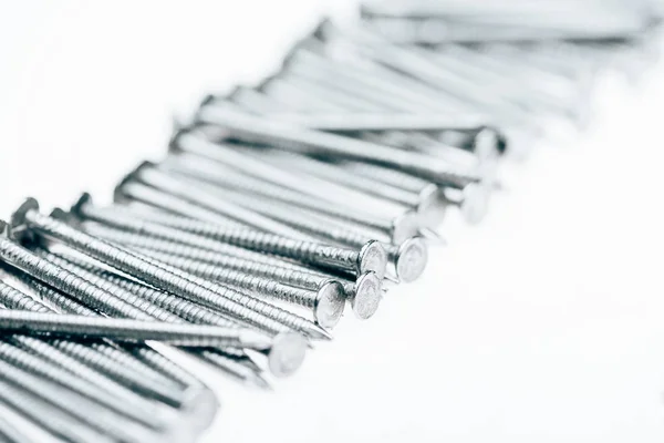 Close up view of metal framing nails isolated on white — Stock Photo