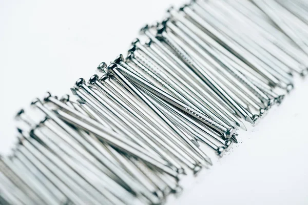 Close up view of metal framing nails isolated on white — Stock Photo