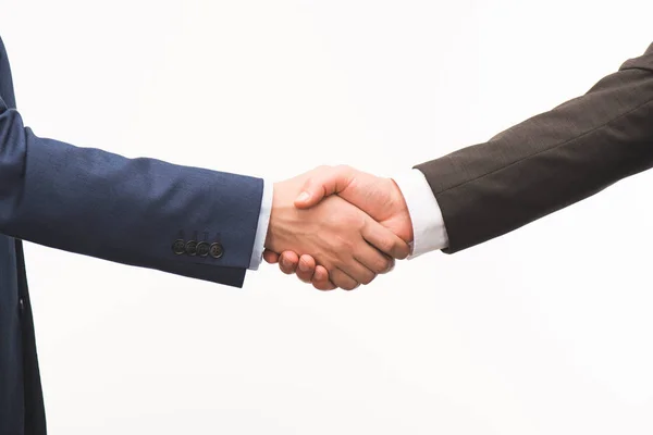 Cropped image of shaking hands isolated on white — Stock Photo