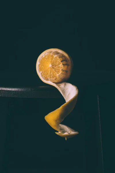 Close up view of ripe and fresh lemon on dark surface — Stock Photo