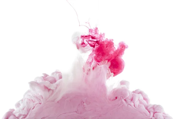 Vista ravvicinata di spruzzi di vernice rosa isolati su bianco — Foto stock