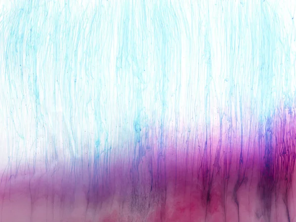 Vista de perto de salpicos de tinta rosa e azul — Fotografia de Stock