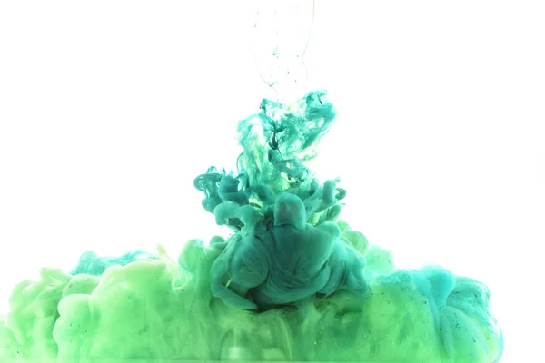 Close up view of mixing of green and blue paint splashes isolated on white — Stock Photo
