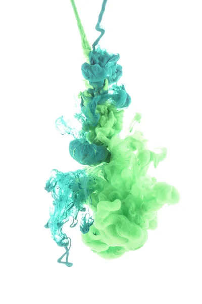 Mixing of green paint splashes isolated on white — Stock Photo