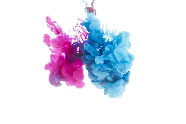 Mixing of blue and pink paint splashes isolated on white — Stock Photo
