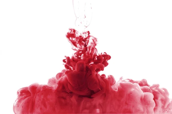 Salpicadura de pintura roja en agua, aislada en blanco — Stock Photo