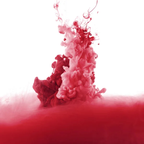 Red paint splash in water, isolated on white — Stock Photo