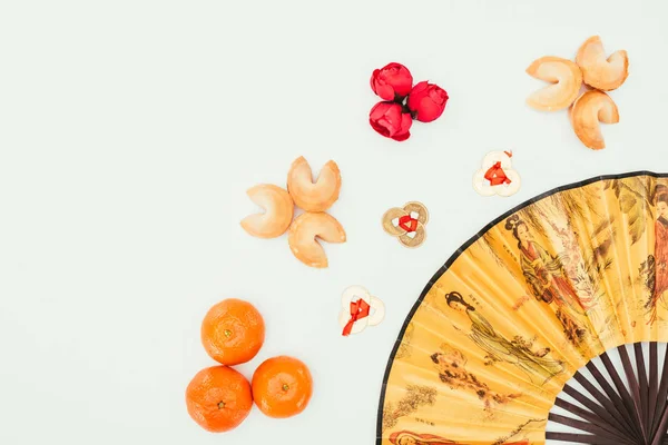 Top view of chinese new year composition with handheld fan isolated on white — Stock Photo