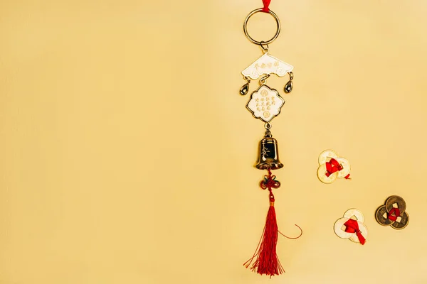 Top view of traditional chinese talisman with coins on yellow, Chinese New Year concept — Stock Photo