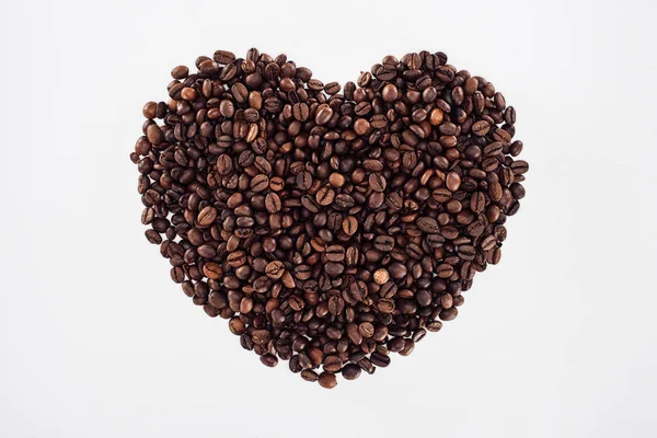 Close-up view of heart made from roasted coffee beans isolated on white — Stock Photo