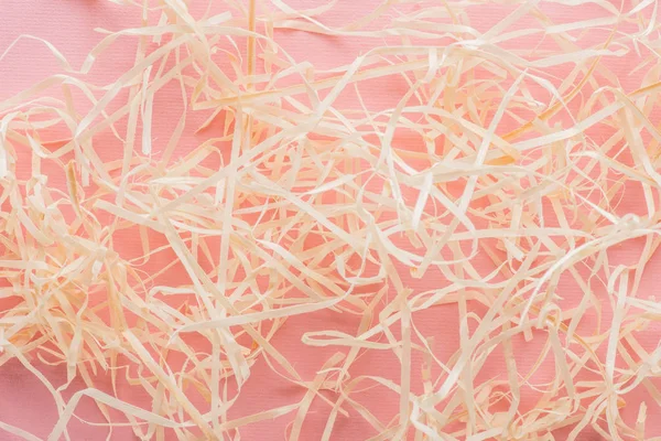 Close up view of decorative straw on pink surface — Stock Photo