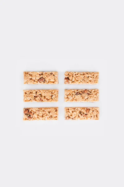 Top view of rows of granola bars isolated on white — Stock Photo